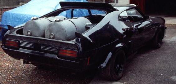 Mad Max Interceptor - Rear of the car at Cars Of The Stars, showing fuel tanks.